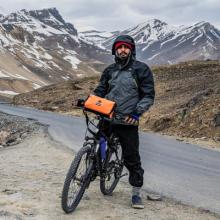 person on bike in mountains